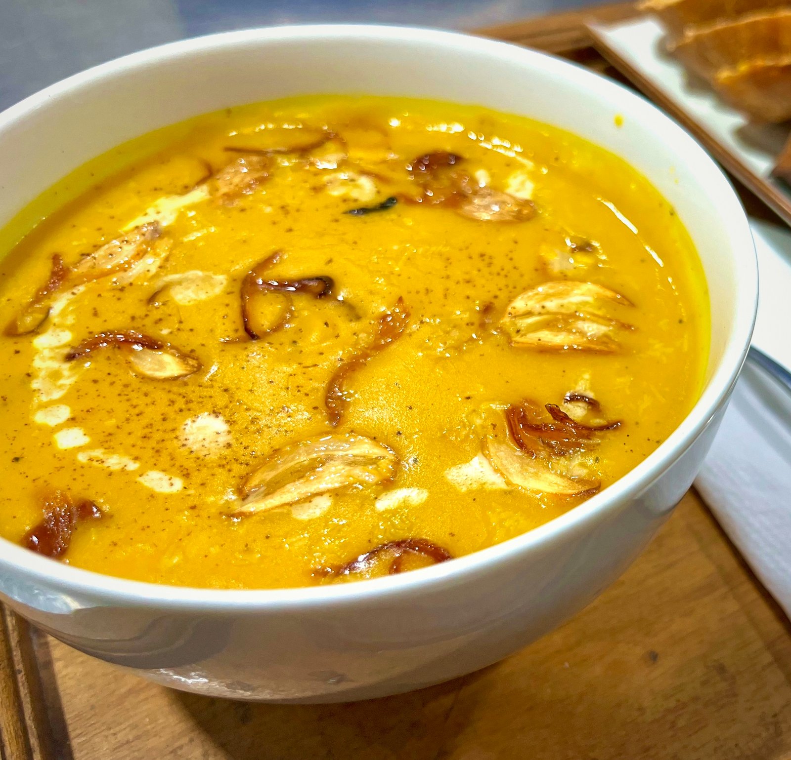 Sri Lankan pumpkin soup with crispy fried shallots and coconut cream at Vinya Garden